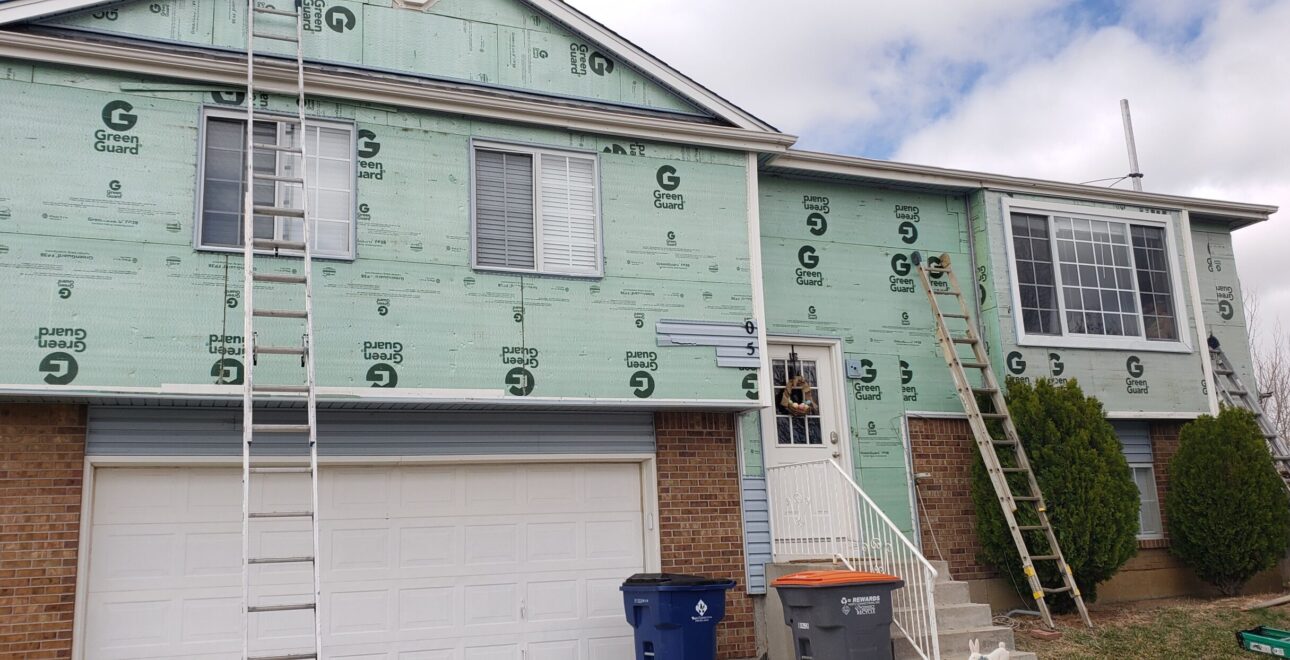 A picture of exterior siding repairs on a home by performance construction.