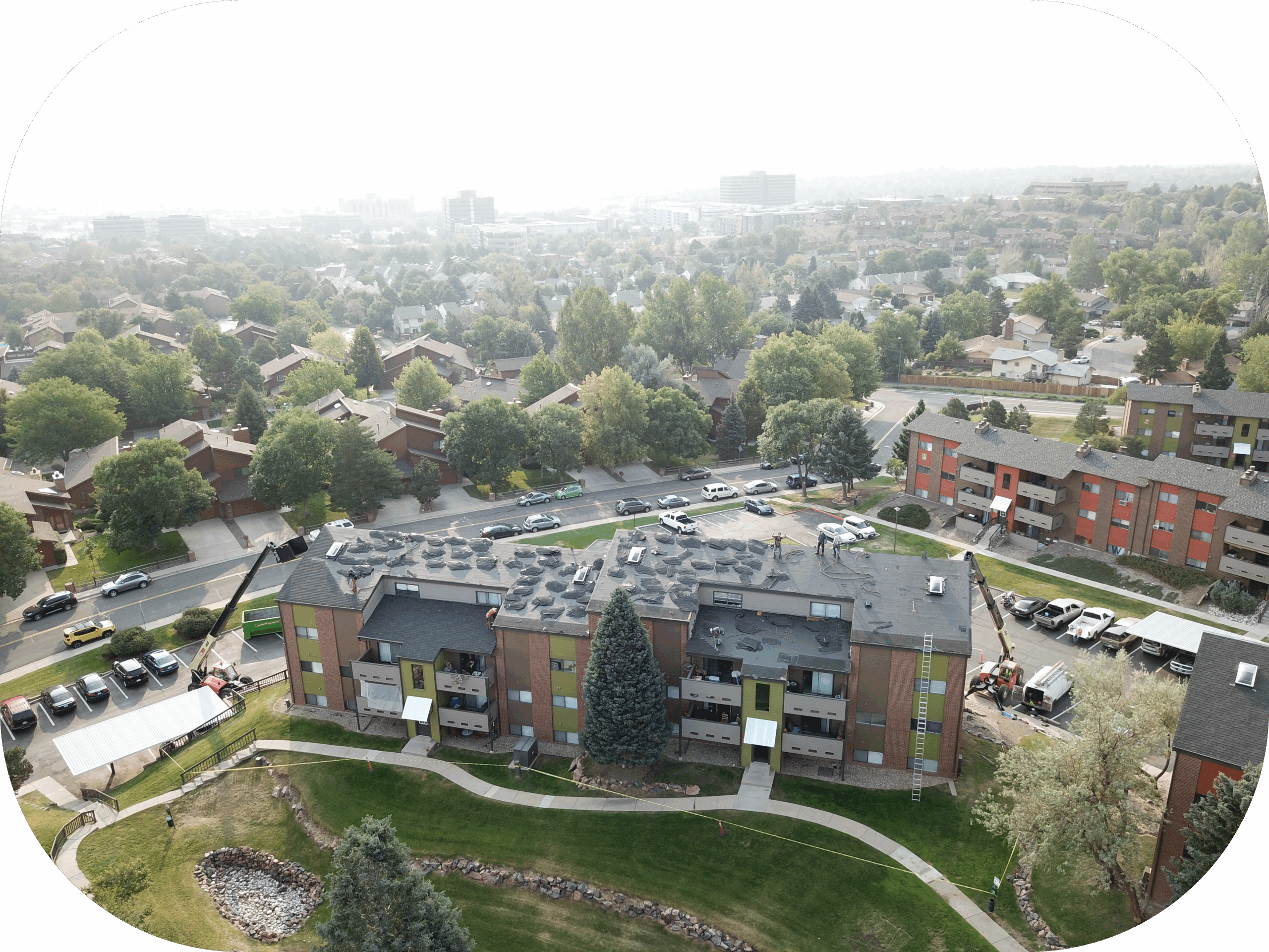 A picture of a completed roofing job on an apartment complex